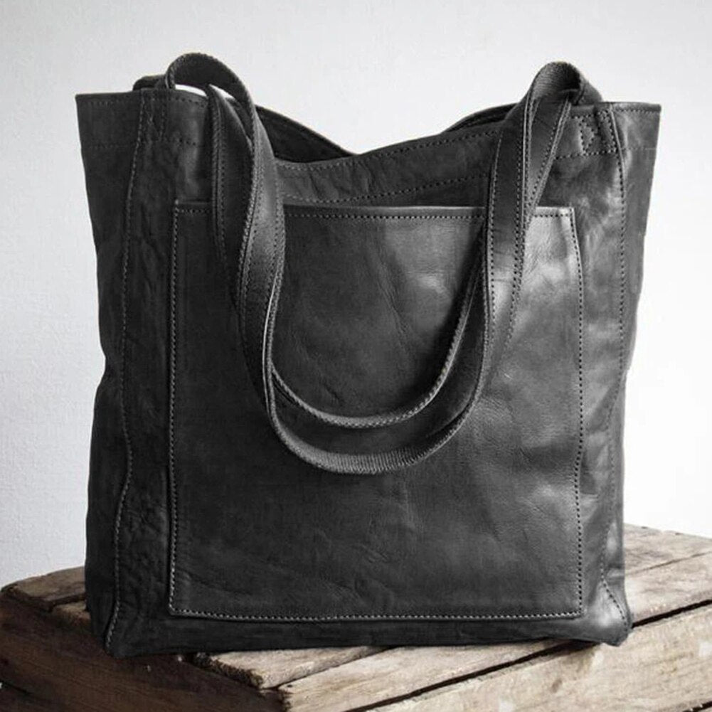 Elegant praktisk läderhandväska