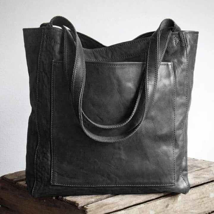 Elegant praktisk läderhandväska