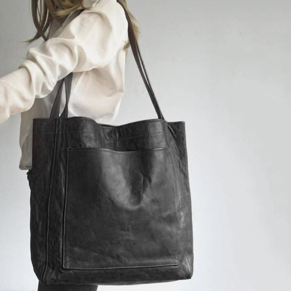 Elegant praktisk läderhandväska
